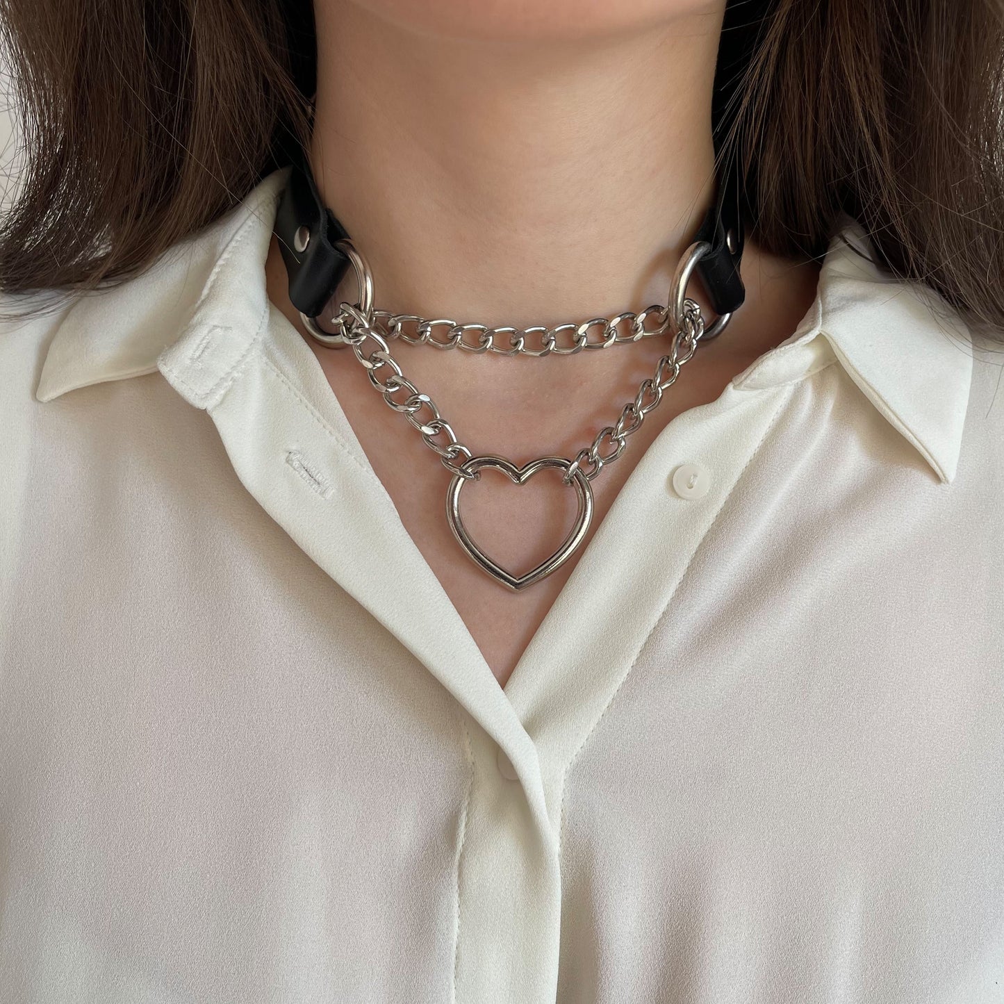Black genuine leather choker with silver heart pendant and double chain, centered front view