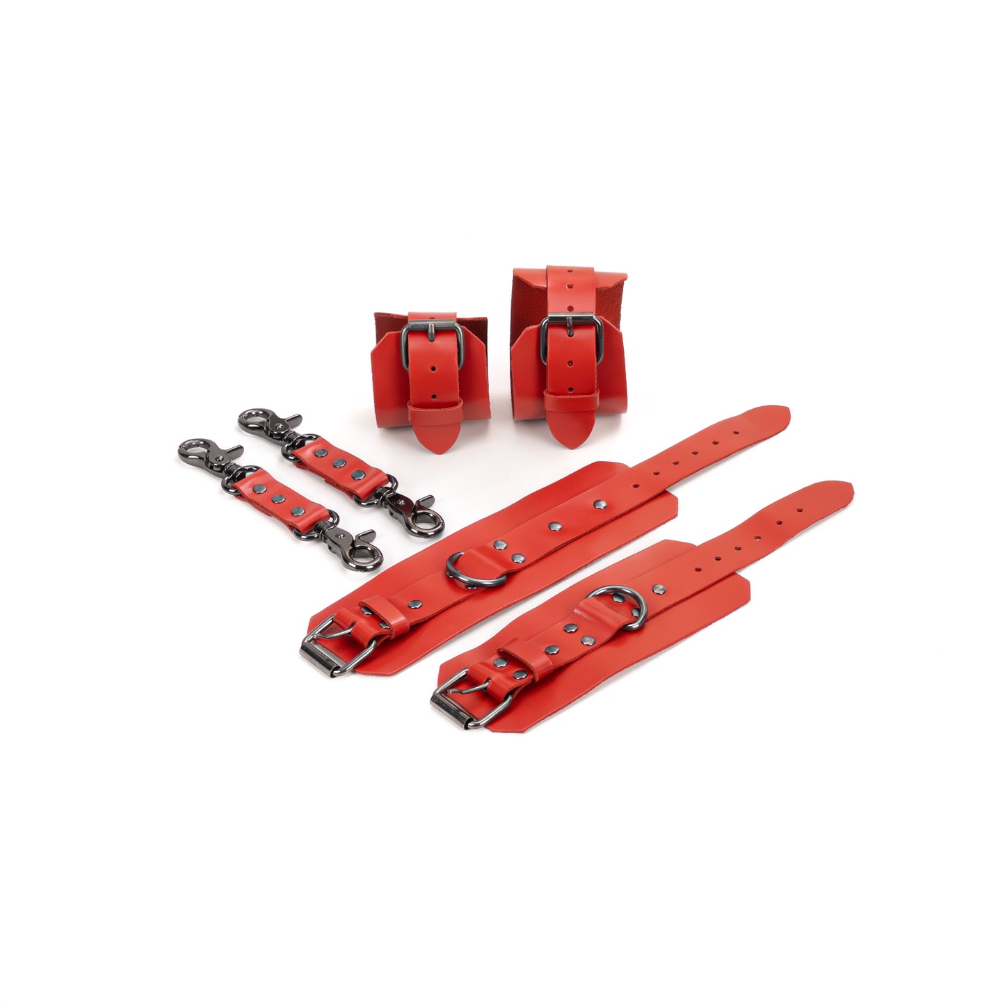 Red leather BDSM set laid flat: wrist cuffs and ankle cuffs with buckle straps, rivets, adjustment holes, and dark nickel hardware. Each cuff includes a 2.5 cm D-ring for attachment. Two leather connectors with dark nickel carabiners on both ends are shown next to the cuffs.