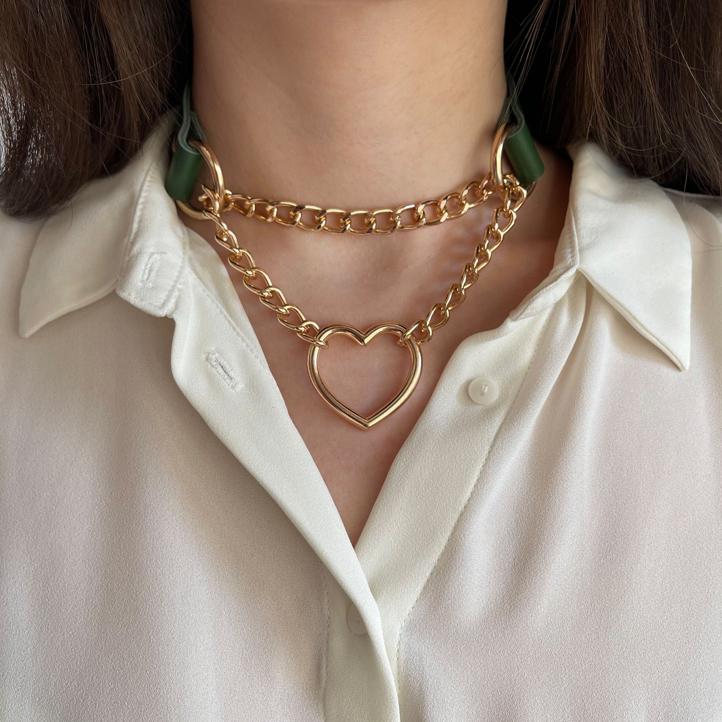 Green genuine leather choker with double gold chain and heart pendant, front view