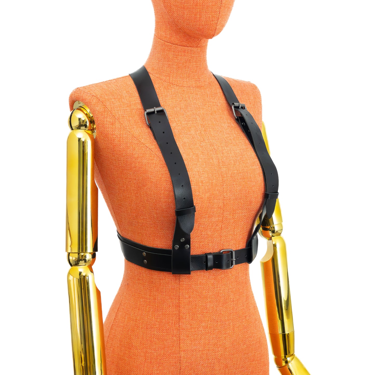 Front view of the reversed configuration on a mannequin, showing a single 1 1/4 inch strap passing between the bust and attaching to the wide 1 1/2 inch waist belt with layered 1 inch strap and central ring; dark nickel hardware visible.