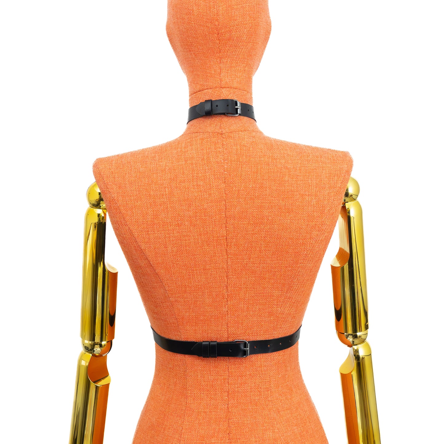 Black genuine leather minimalist O-ring harness on mannequin, dark nickel hardware, back view showing buckle closures on 3/4 inch (2 cm) choker and waist belt and clean strap layout; leather thickness 1.4–1.8 mm.