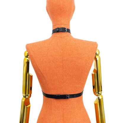 Black genuine leather minimalist O-ring harness on mannequin, dark nickel hardware, back view showing buckle closures on 3/4 inch (2 cm) choker and waist belt and clean strap layout; leather thickness 1.4–1.8 mm.