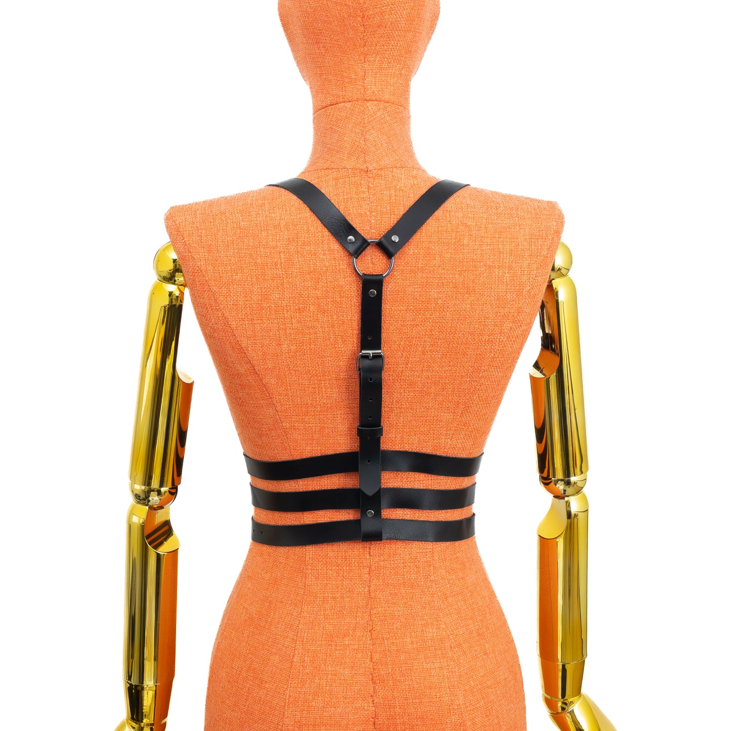Triple Waist Strap Leather Harness on mannequin, back view, genuine black leather with dark nickel hardware, vertical spine strap with buckle, ring between shoulder blades and three horizontal waist straps with adjustable buckles; leather thickness 3–4 oz (1.4–1.8 mm).