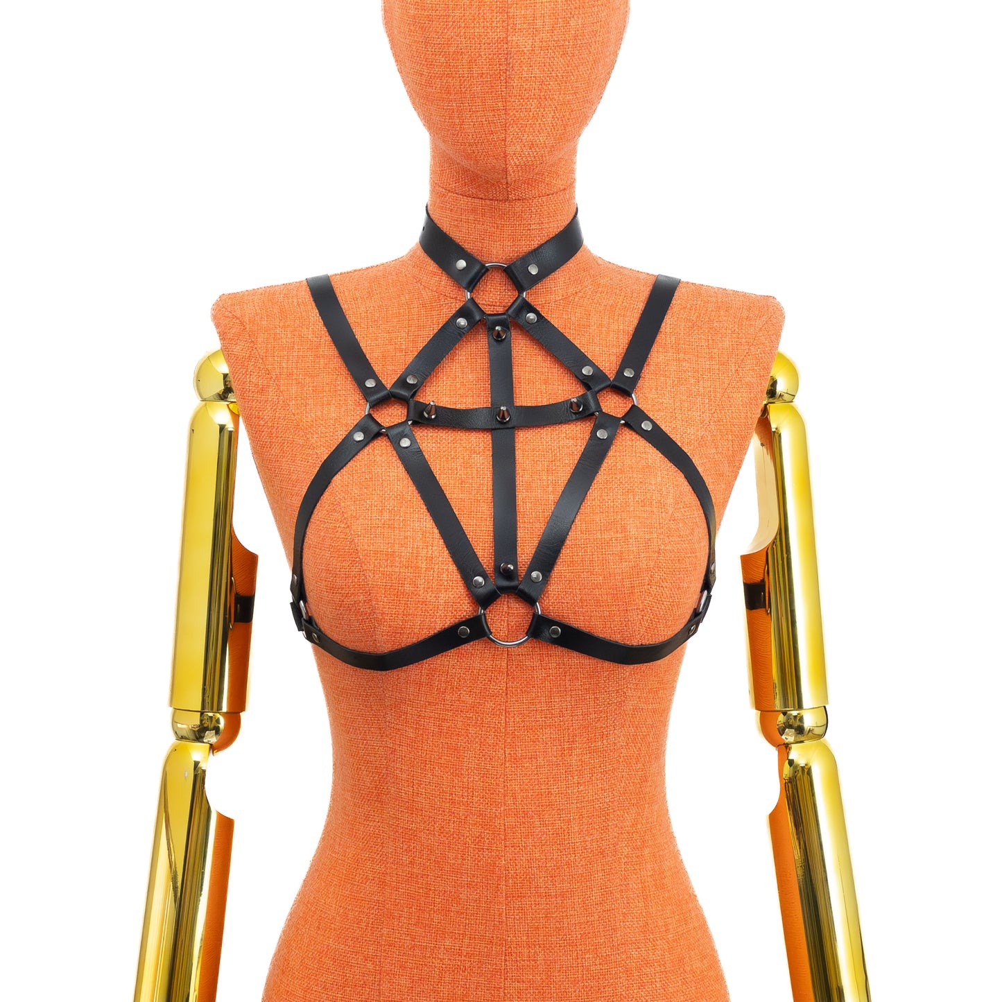 Black genuine leather gothic cross open bust chest harness bra on mannequin, dark nickel rings and spikes, front view showing 3/4 inch choker, central neck ring, cross pattern made of 5/8 inch straps and lower ring between bust connected to underbust strap.