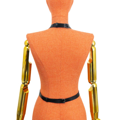 Back view of black leather choker waist harness on mannequin, buckle closure at neck and adjustable waist strap fastening at the back, side straps connected to hip rings; strap width 3/4 inch (20 mm), leather thickness 1.4–1.8 mm, metal hardware.