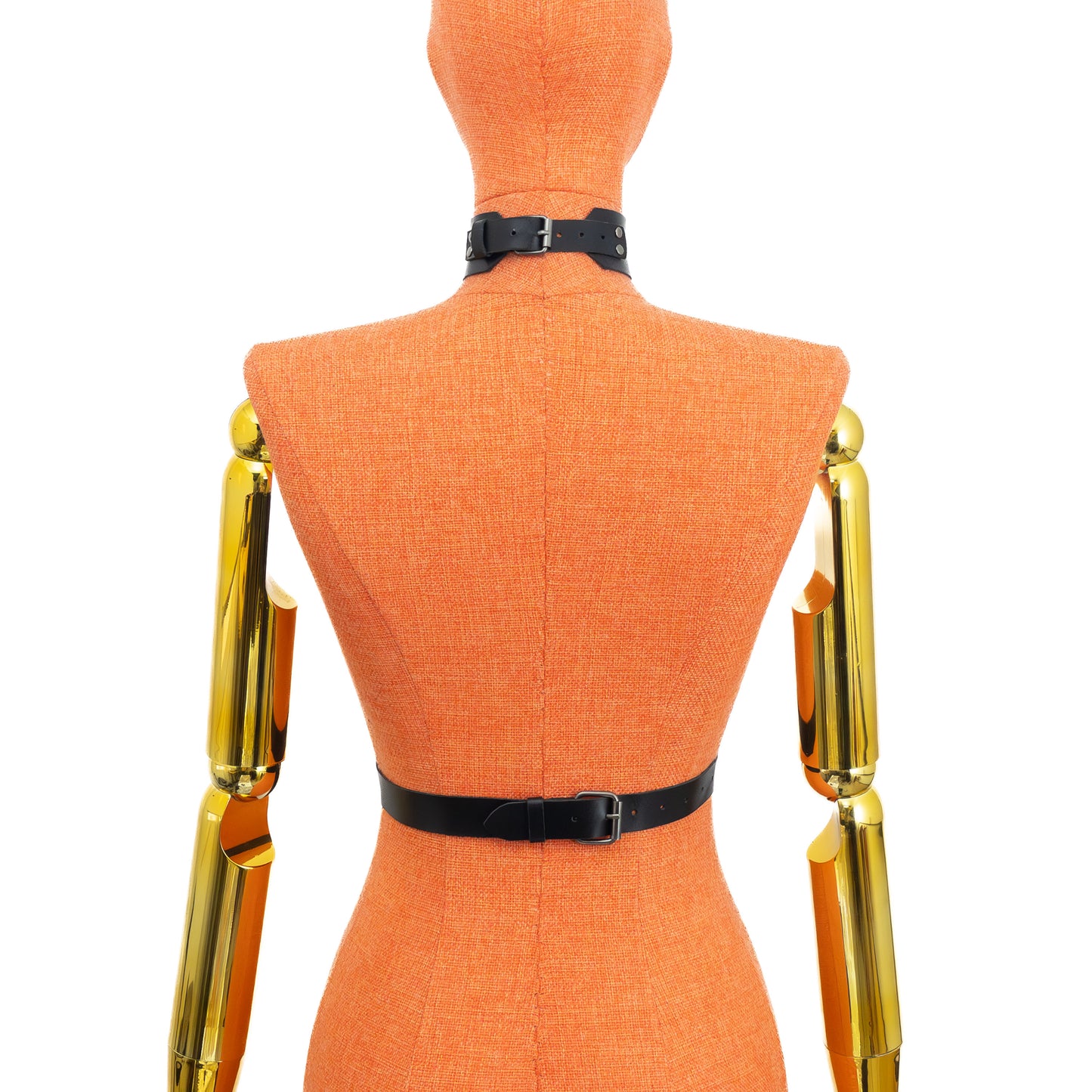 Back view of black leather harness with wide 1 1/2 inch collar on a mannequin, showing buckle closure at the collar and 1 inch waist belt fastening at the back; dark nickel hardware visible.