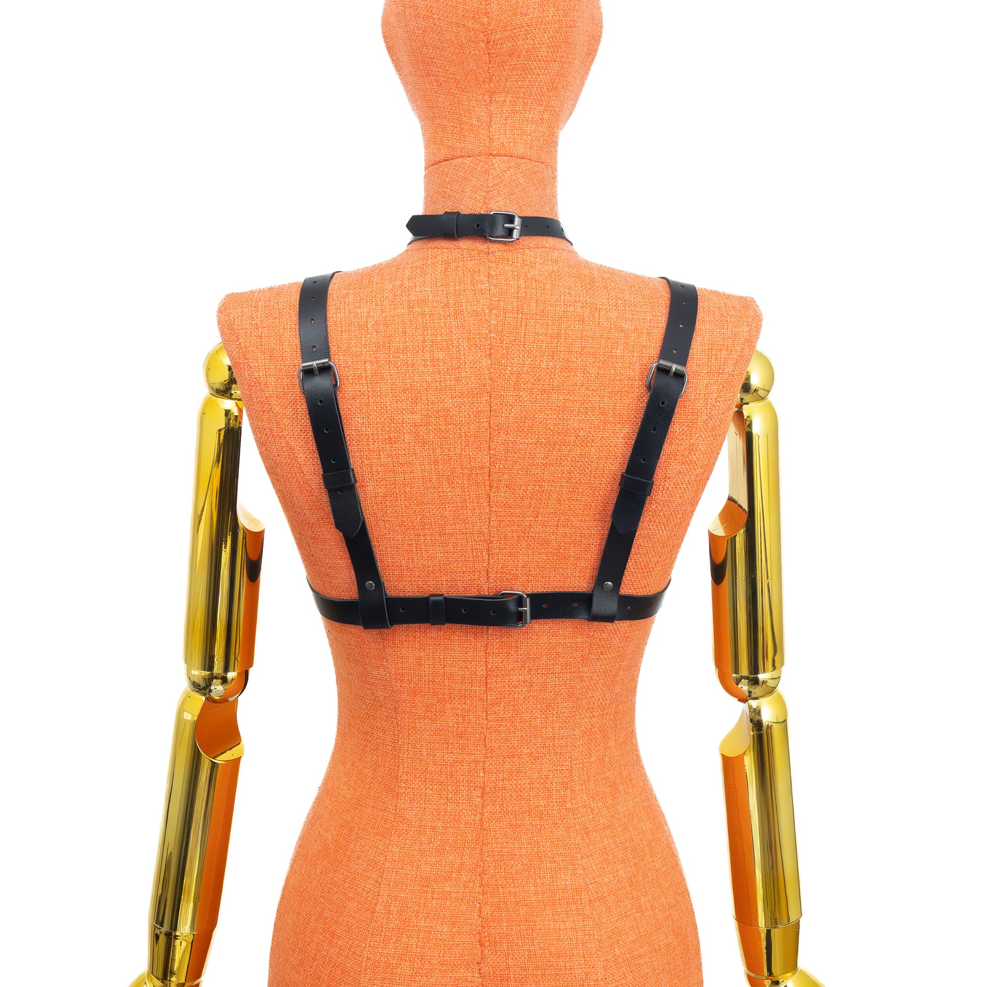 Mannequin back view showing bra-style adjustable back straps and choker buckle; 3/4 inch (2 cm) horizontal and vertical straps, 5/8 inch (1.5 cm) collar; black leather 1.4–1.8 mm thick, dark nickel hardware.
