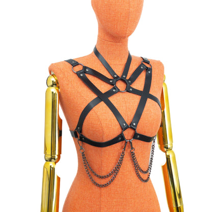 Three-quarter mannequin angle showing pentagram strap layout, detachable chains and adjustable buckle system; 5/8 inch (1.5 cm) choker, 3/4 inch (2 cm) straps; black leather 1.4–1.8 mm thick, dark nickel hardware.