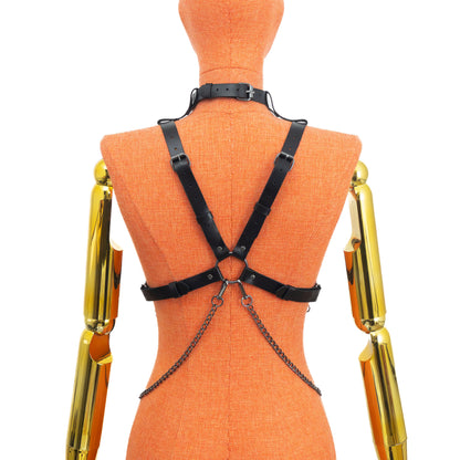 Leather Harness with Chains and Detachable O-Ring Choker on mannequin, back view, genuine black leather with dark nickel hardware, X-back adjustable straps and central rear ring, layered chains attached to rear ring; leather thickness 3–4 oz (1.4–1.8 mm), strap width 3/4 inch (20 mm).