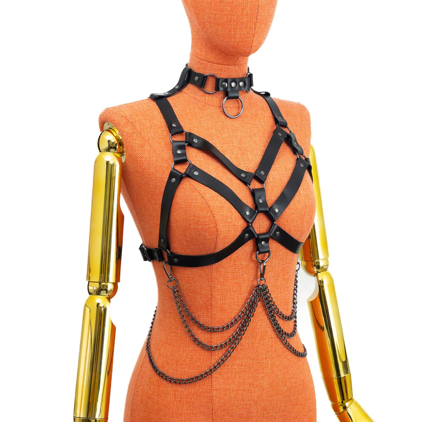 Leather Harness with Chains and Detachable O-Ring Choker on mannequin, angled view, black leather double chest strap pattern, shoulder straps with loops for choker attachment, layered chain drape; leather thickness 3–4 oz (1.4–1.8 mm), strap width 3/4 inch (20 mm).