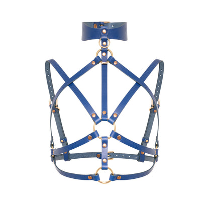 Front close-up of a deep blue open woven leather chest harness with a wide wave-shaped collar, small O-ring, center ring between the breasts, thin adjustable straps, and gold-tone metal hardware.