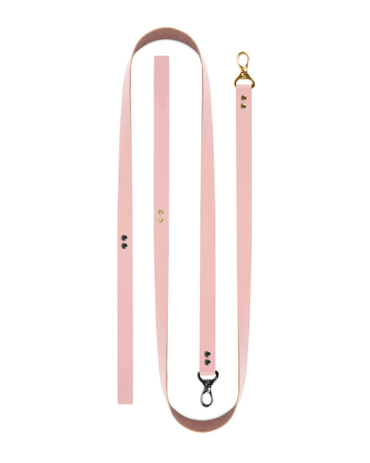BDSM full leather leash on a white background made from a single solid pink leather strap, 100 cm (39.37 in) length, 2 cm (0.79 in) width, 1.4–1.8 mm (0.06–0.07 in) thickness, product laid flat showing uniform leather thickness.