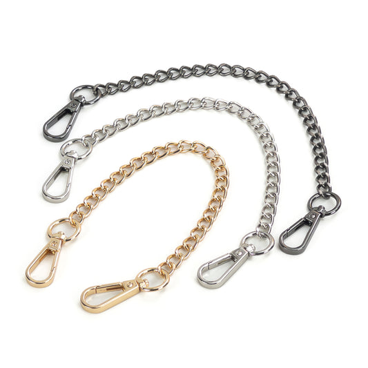 Short metal chain connector with carabiners shown on a white background, three versions displayed together: gold, silver, and dark nickel. Each connector consists of a single 20 cm metal chain with a carabiner on both ends, laid flat so the full length, chain links, and hardware color differences are clearly visible.