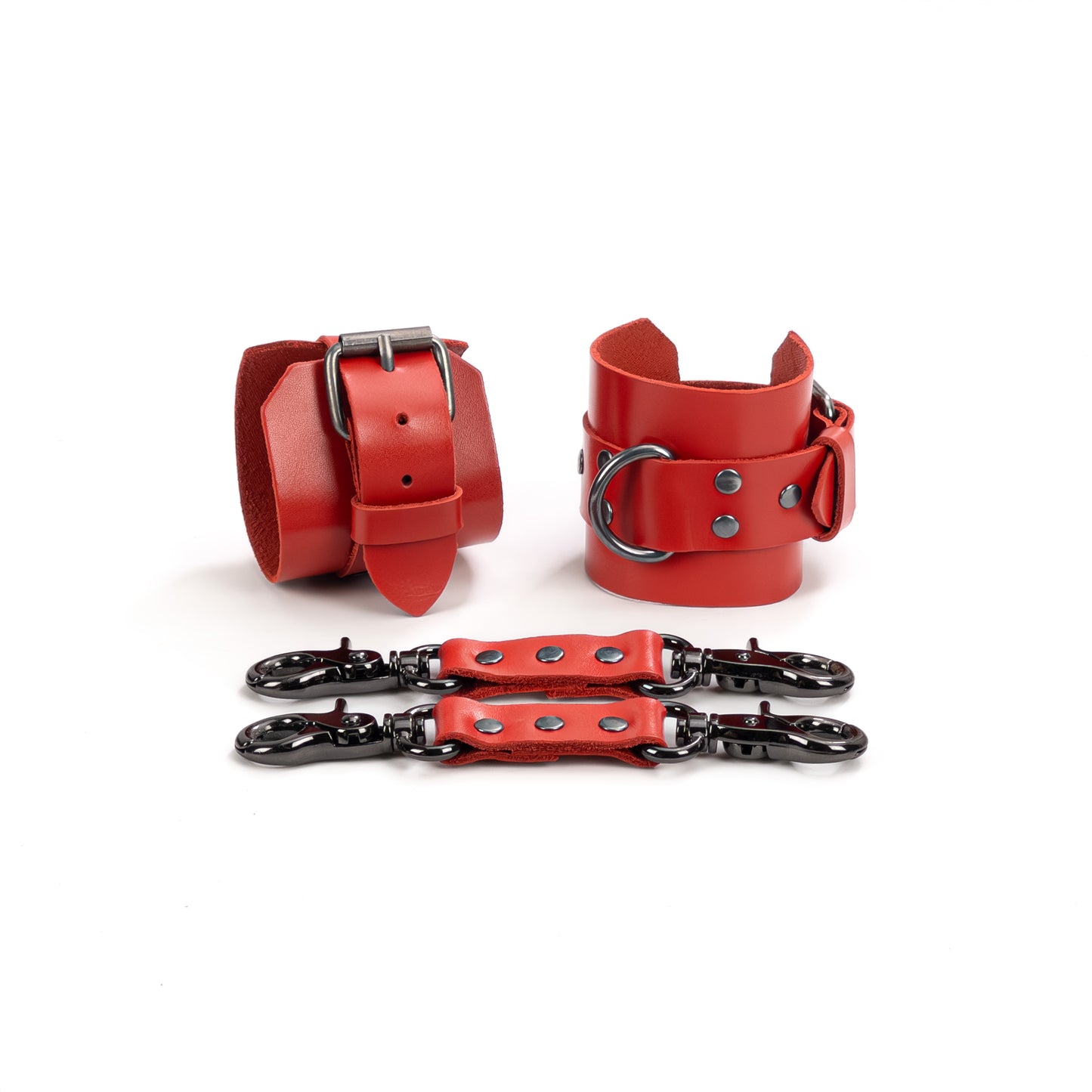 Red leather handcuffs with metal hardware shown on a white background, featuring 6 cm (2.36 in) wide cuffs and 2.5 cm (0.98 in) adjustable straps, with leather connectors and metal carabiners placed in front.