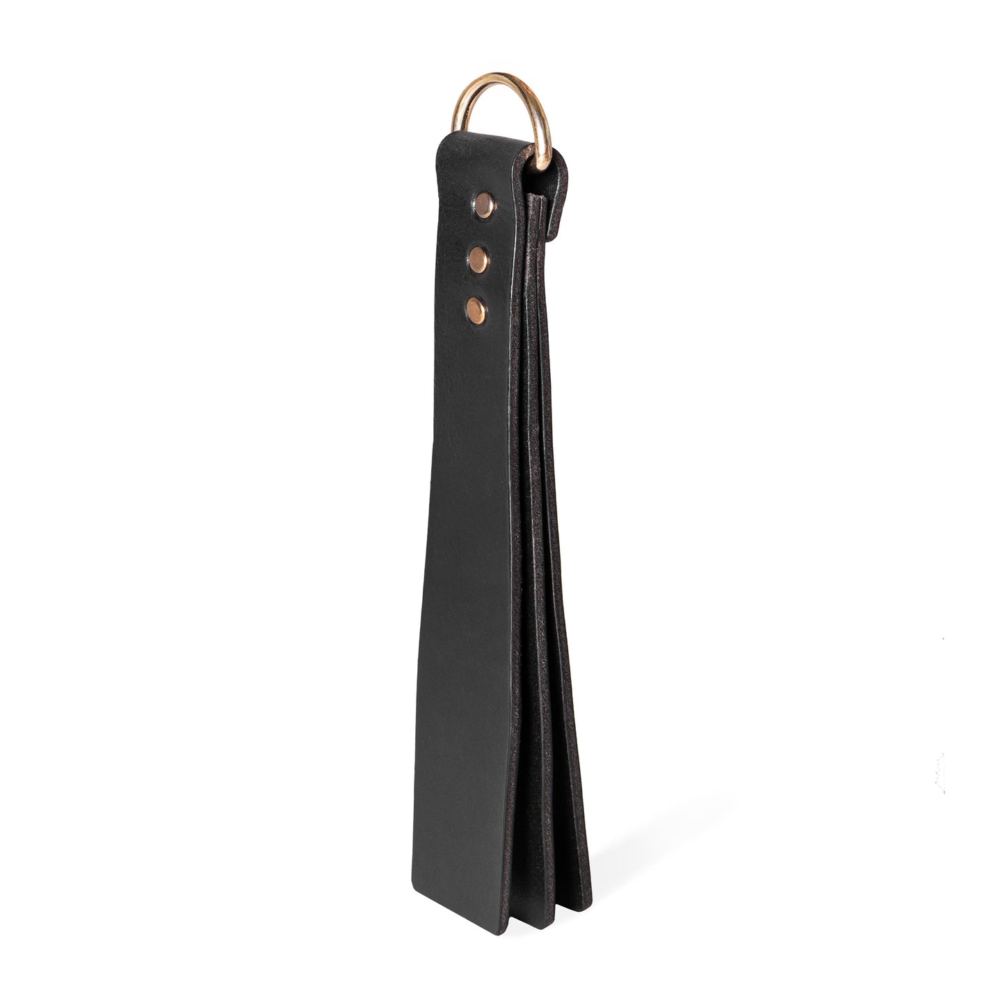 Handmade Basic Wide leather BDSM paddle photographed upright on a white background. The image shows a three-layer leather construction with a wide striking surface and a metal D-ring attached to the handle.