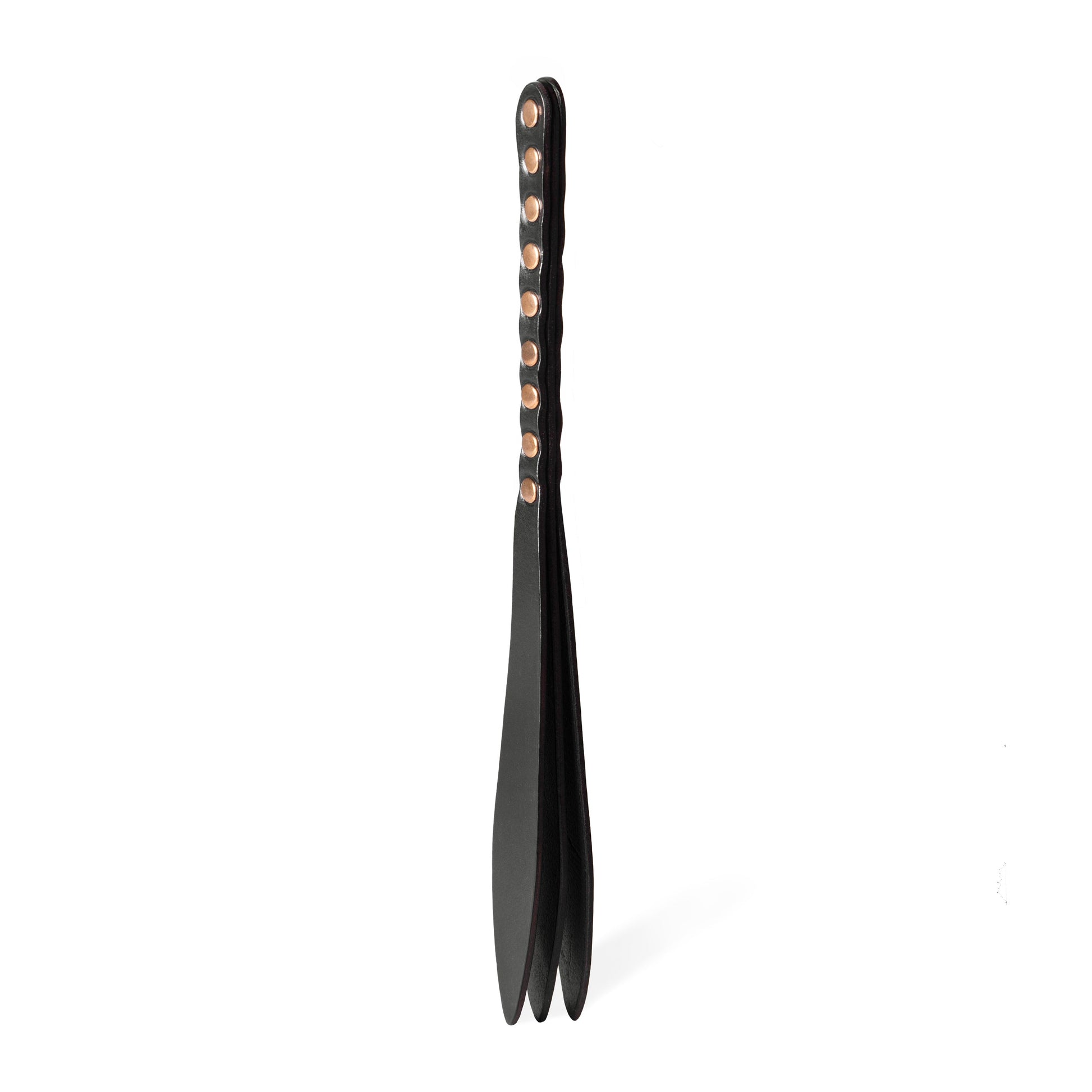 Handmade Submissive Tear leather BDSM paddle photographed upright on a white background. The image shows a three-layer leather construction with a slim handle, teardrop-shaped striking surface, and smooth rounded profile designed for controlled impact play.