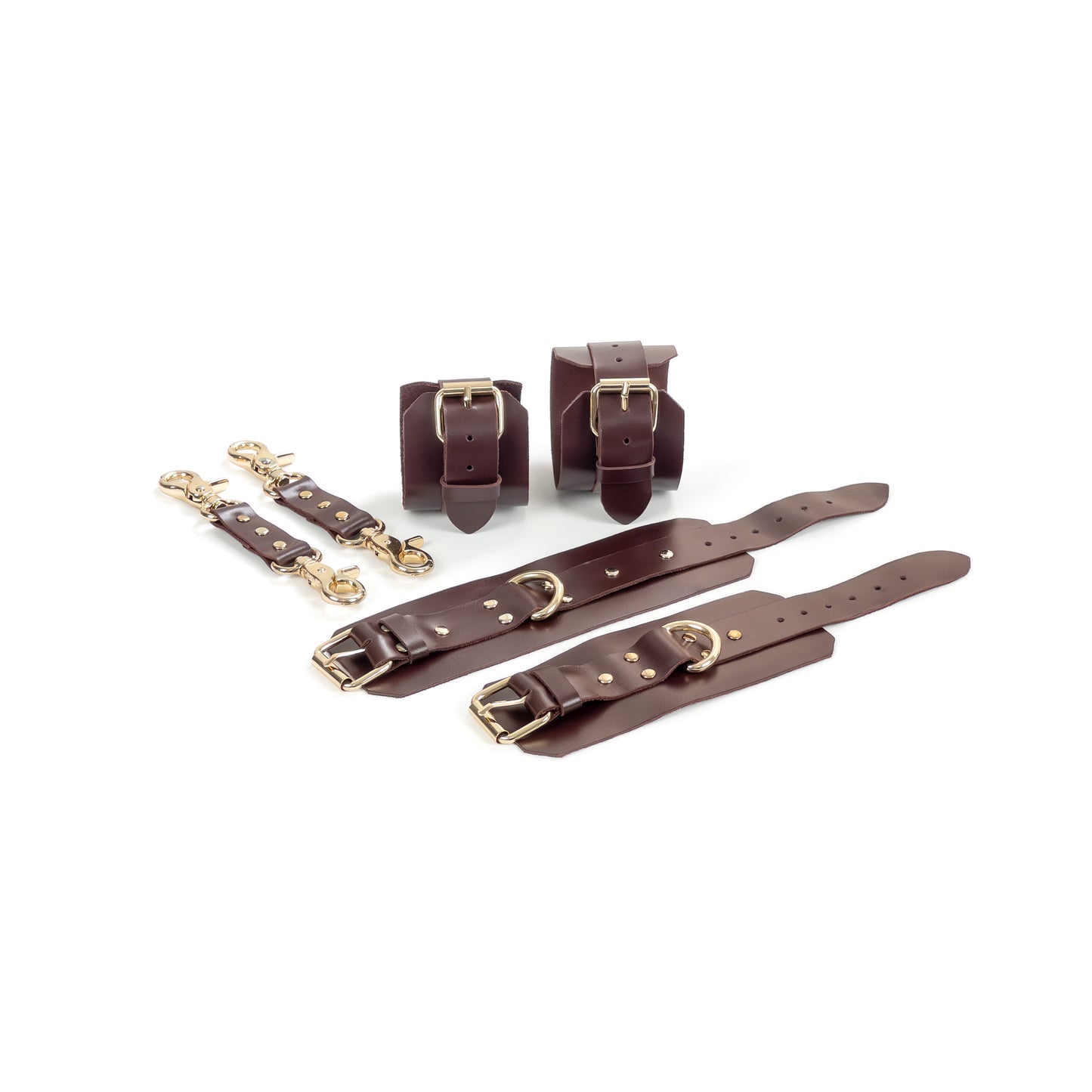 Marsala leather BDSM set laid flat: wrist cuffs and ankle cuffs with buckle straps, rivets, adjustment holes, and gold-tone hardware. A 2.5 cm D-ring is visible on each cuff. Two leather connectors with gold-tone carabiners on both ends are placed beside the cuffs.