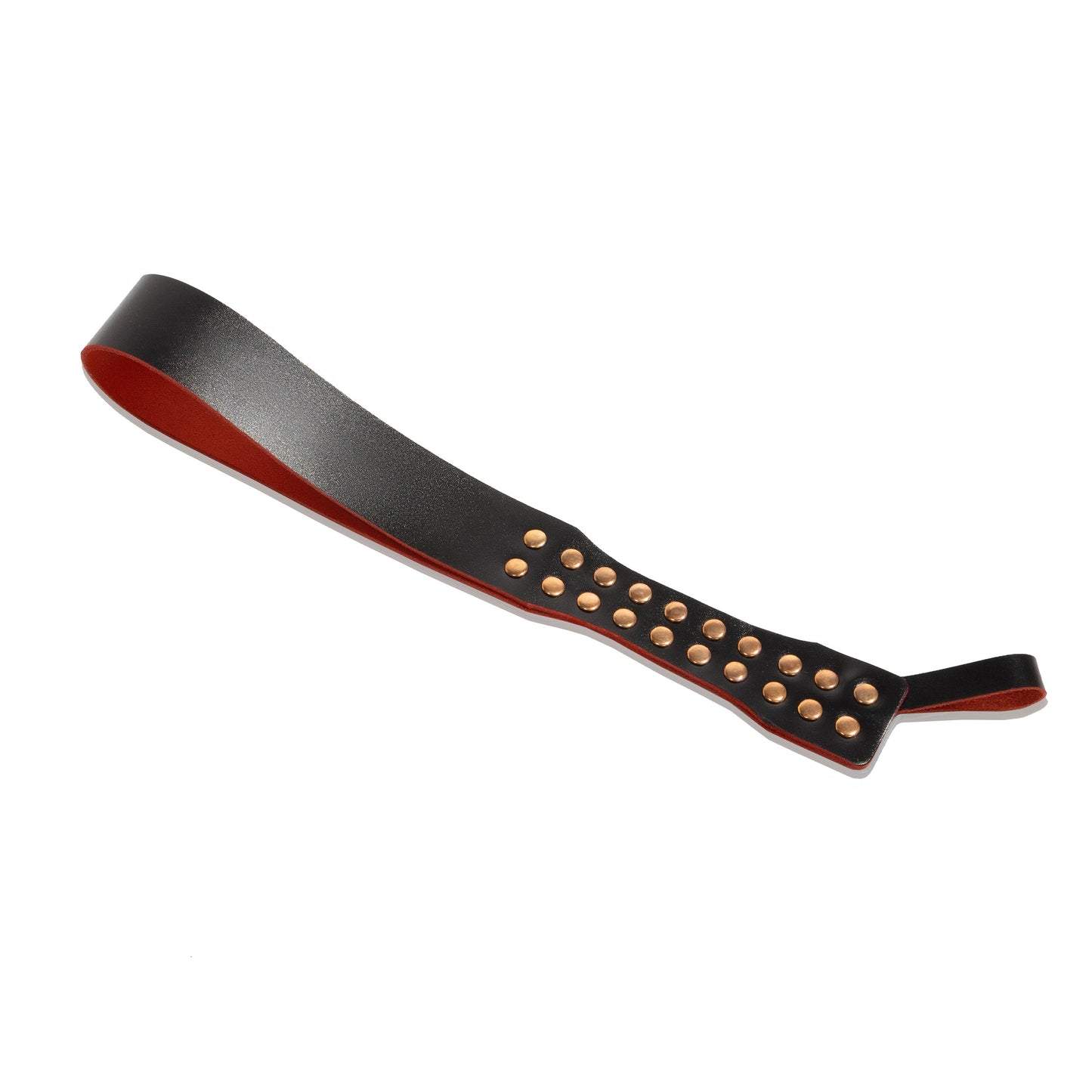 Handmade Loop Core leather paddle displayed flat on a white background. The image shows the distinctive loop construction, decorative metal studs, and the narrow striking profile of the paddle.