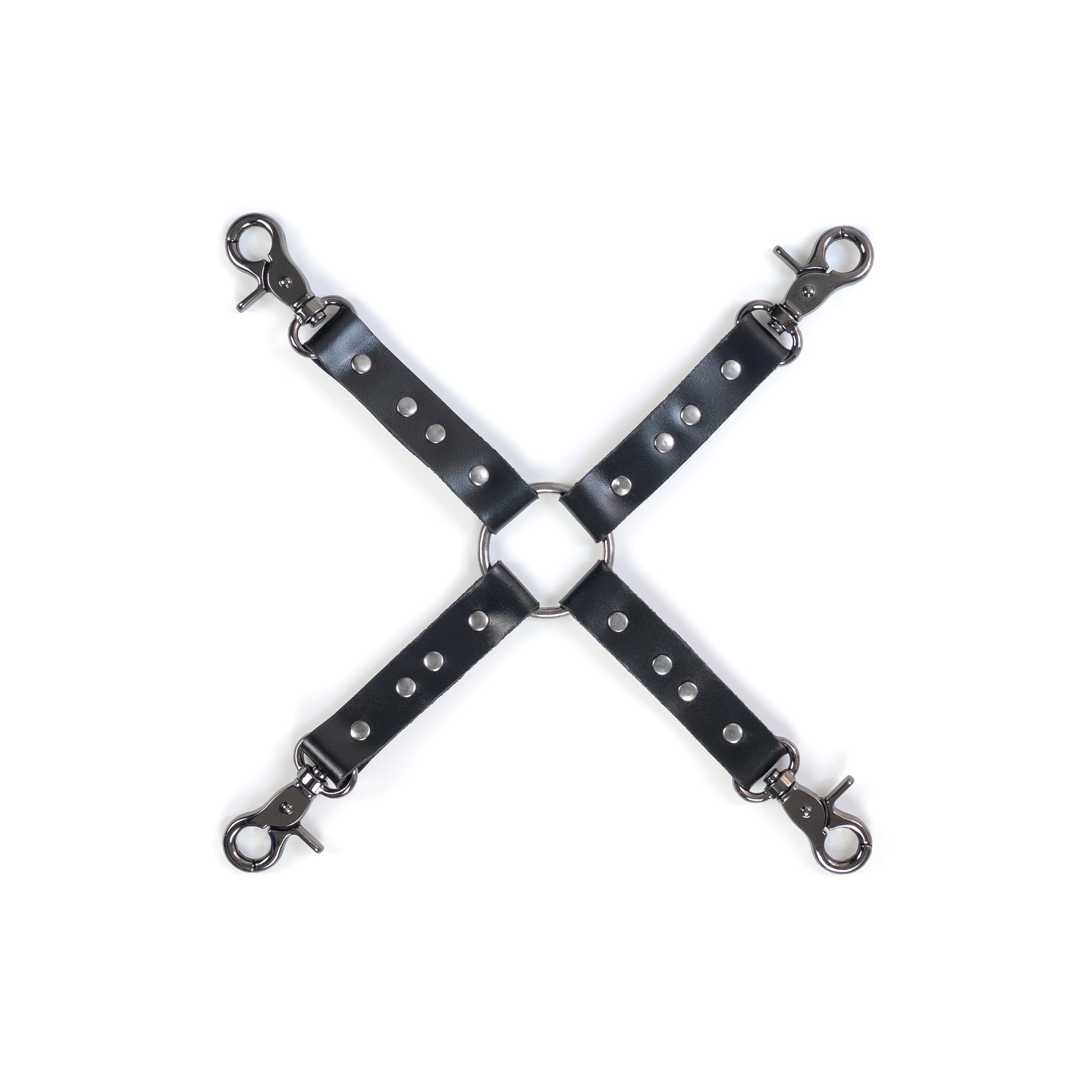 Four-way leather restraint connector made of black genuine leather with dark nickel metal hardware, central metal ring with four attachment ends, each end has a dark nickel carabiner, shown flat on a white background, top view with stitching and rivets visible.