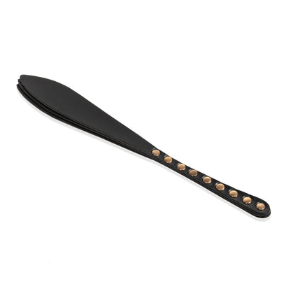 Handmade Submissive Tear leather paddle displayed flat on a white background. The photo highlights the elongated slim handle, layered leather construction, rounded teardrop striking end, and clean symmetrical profile