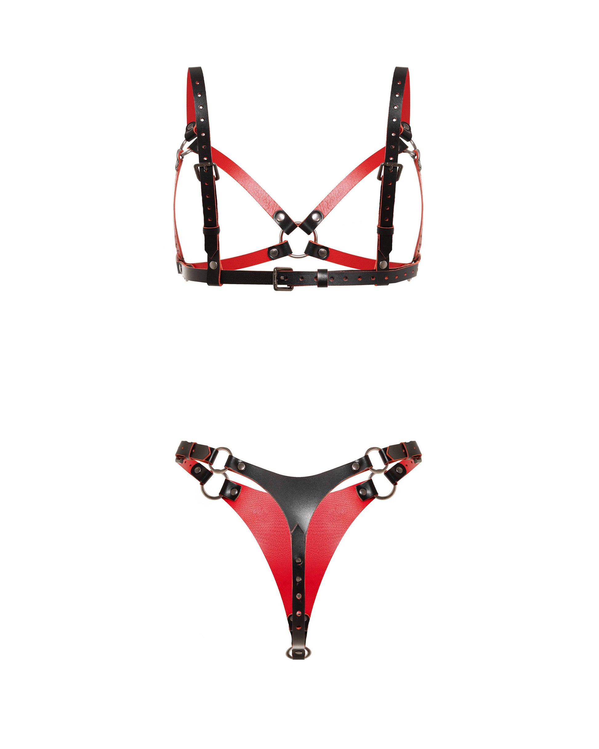 Rear view of a leather open bra and leather thong set in black and red genuine leather. The open bra has crossed leather straps, adjustable shoulder straps, side straps, and a buckle-adjusted back band. The leather thong has a rear leather panel, side buckle straps, and metal rings on both sides.