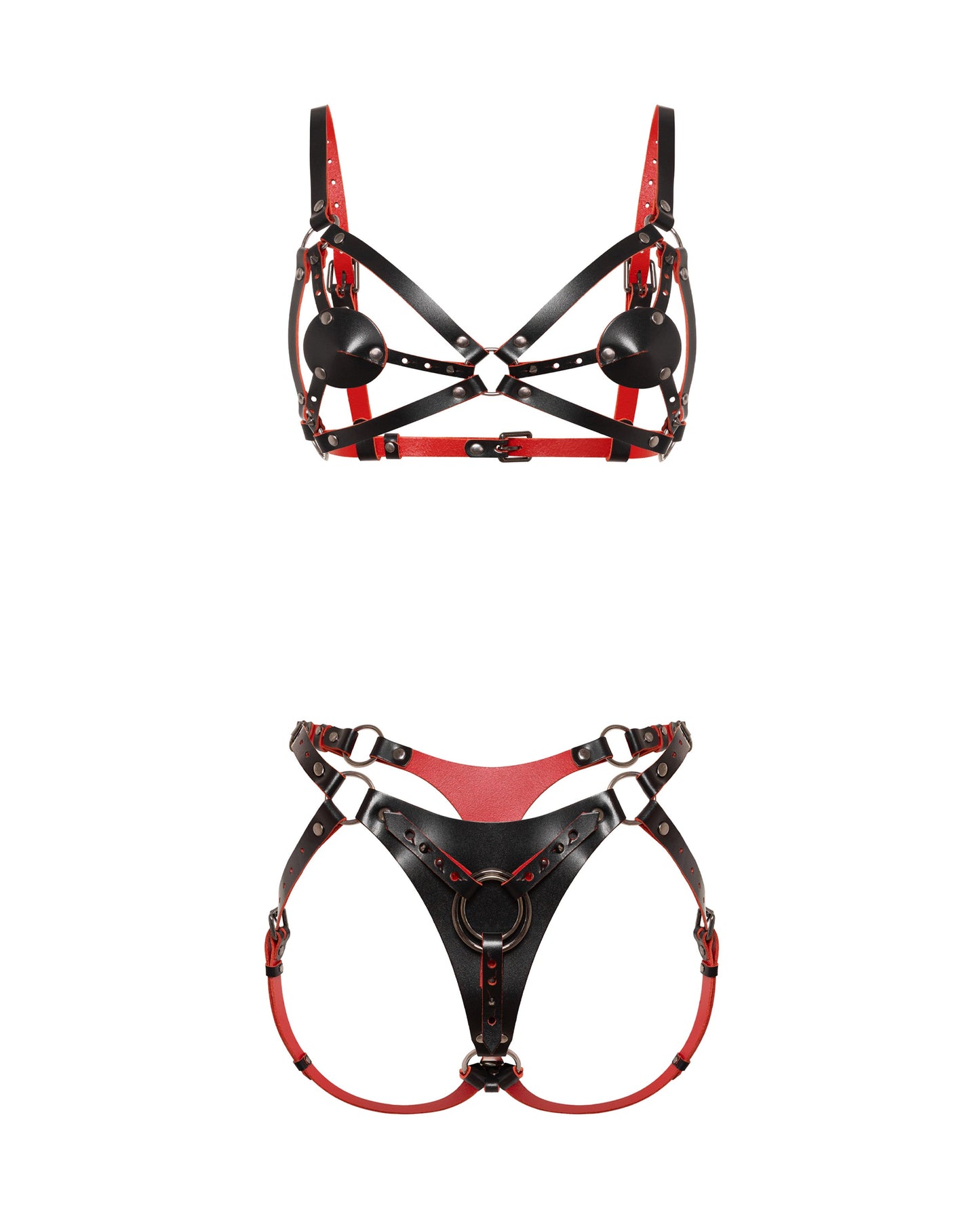 Front view of a reversible leather harness bra and matching strap-on harness crafted from black and red dual-color leather. The contour bra includes removable leather nipple covers attached with adjustable Chicago screws, allowing the coverage pieces to be repositioned or removed entirely while preserving the harness design. The matching front strap-on harness features a large triangular center panel with adjustable leather straps and movable metal rings for compatibility with different strap-on ring sizes.