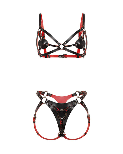 Front view of a reversible leather harness bra and matching strap-on harness crafted from black and red dual-color leather. The contour bra includes removable leather nipple covers attached with adjustable Chicago screws, allowing the coverage pieces to be repositioned or removed entirely while preserving the harness design. The matching front strap-on harness features a large triangular center panel with adjustable leather straps and movable metal rings for compatibility with different strap-on ring sizes.