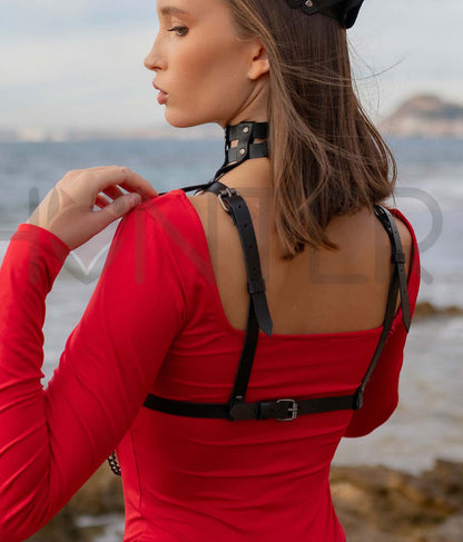 Diamond Pattern Leather Harness Choker with Underbust Chains worn on model, back view, genuine black leather with dark nickel hardware, bra-style back structure, shoulder straps leading to buckle closure, collar buckle fastening visible; strap width 5/8 inch (15 mm), leather thickness 3–4 oz (1.4–1.8 mm).
