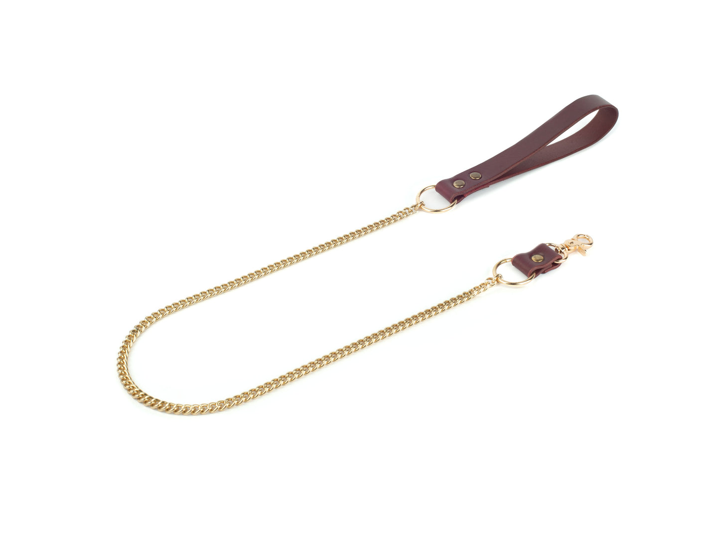 Gold chain strap with leather handle on a white background