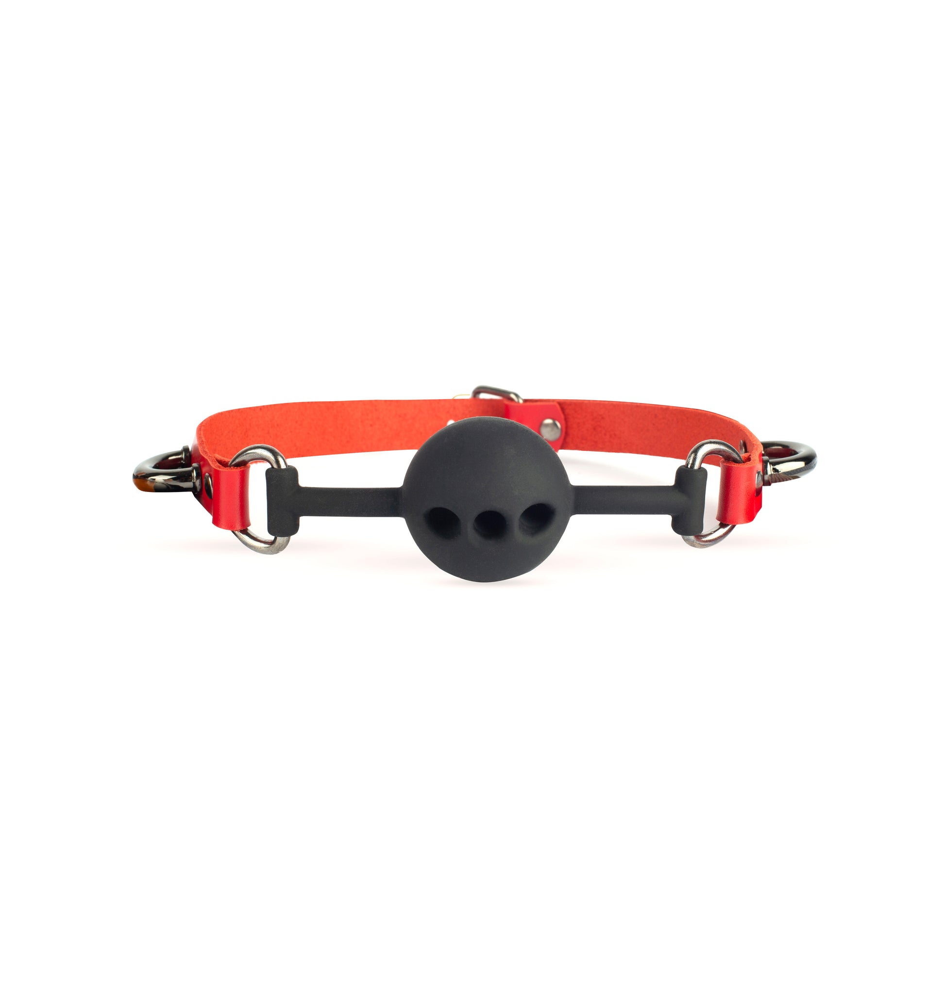 Leather ball gag made of genuine red leather with dark nickel metal hardware and a black silicone ball with three breathing holes. Front profile on white background shows two metal D-rings and additional side attachment arcs near the D-rings, 5/8 inch (1.5 cm) strap and 3–4 oz (1.4–1.8 mm) leather thickness.