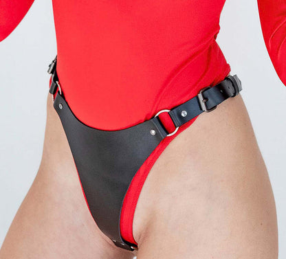 Red swimsuit with black straps on a plain background