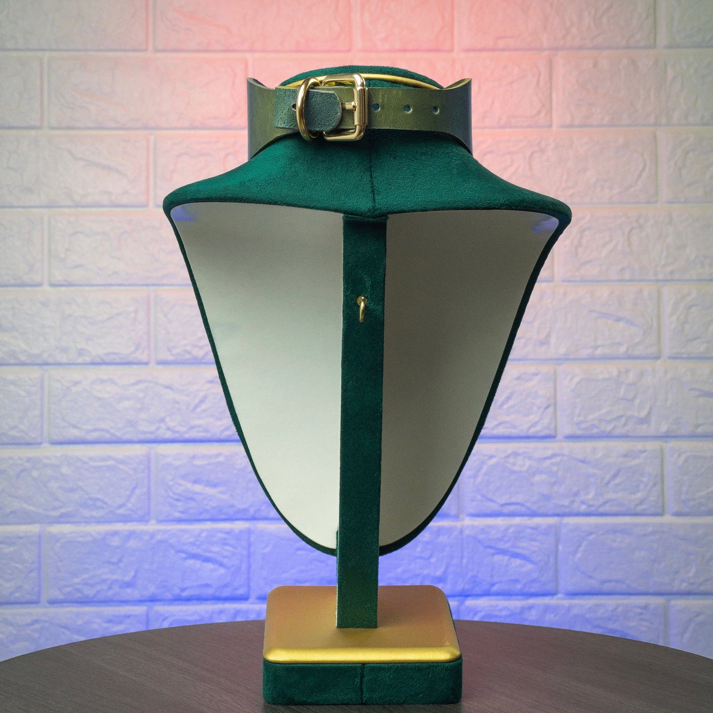 Green leather collar with black hardware, back view