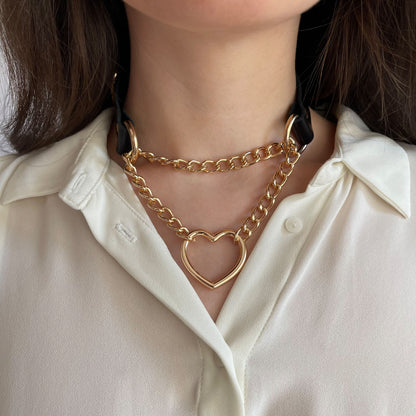 Black genuine leather choker with gold heart-shaped hardware and double chain, front shot