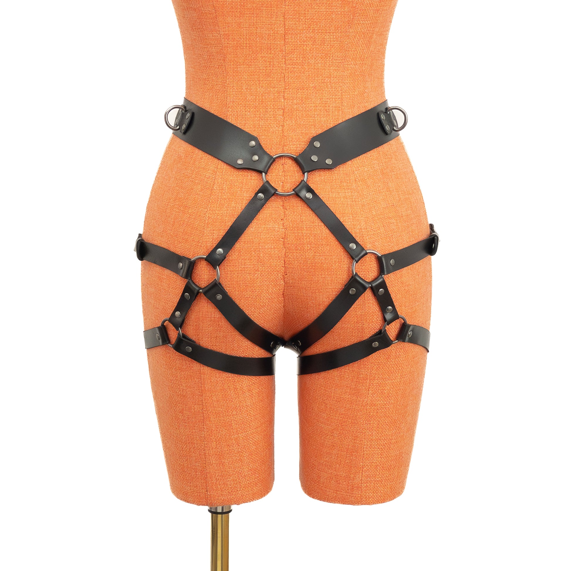 Black genuine leather open butt garter belt with dark nickel hardware on mannequin, rear view showing central back ring and double straps across buttocks.