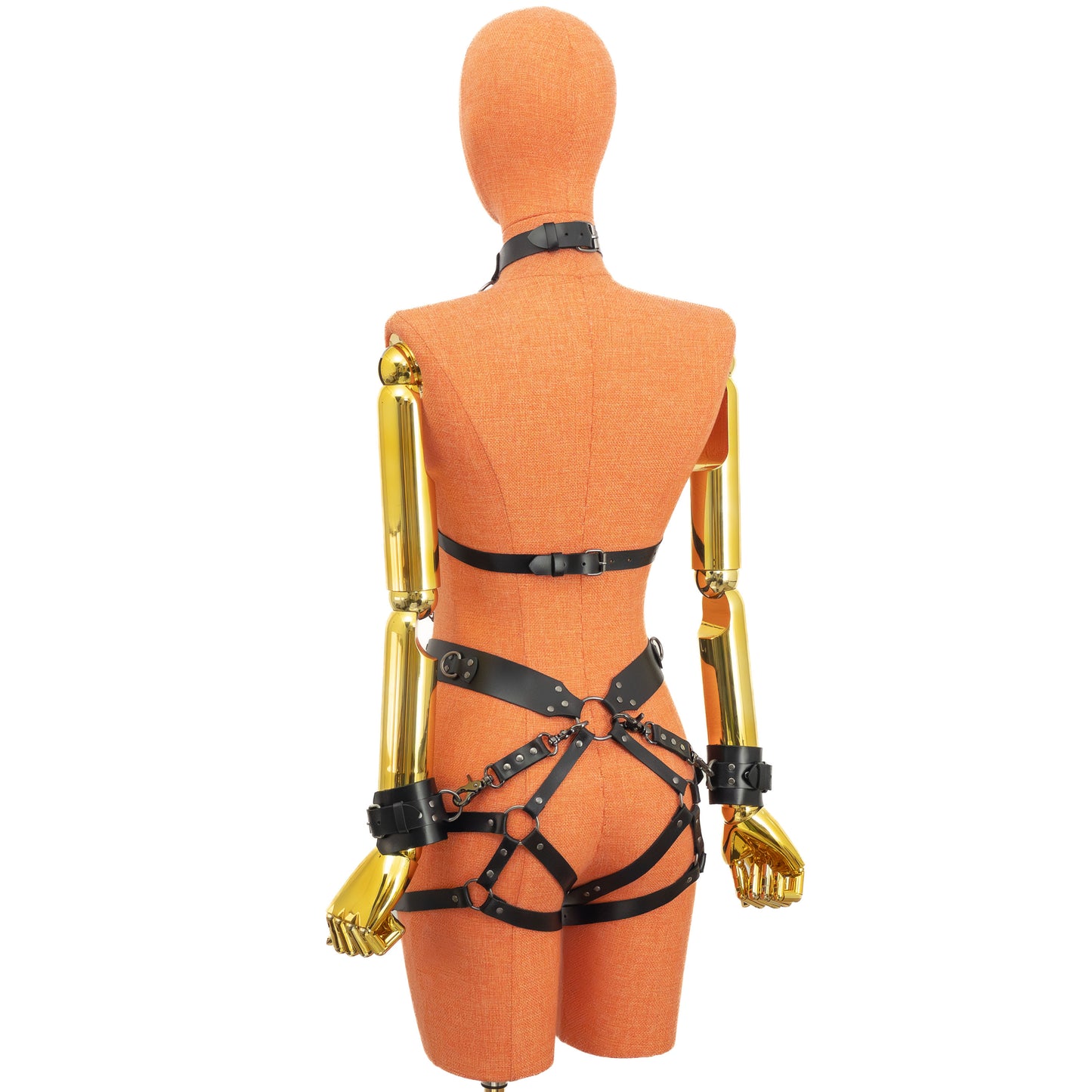 Side view of the back of the outfit showing how the garter straps pass over the buttocks and connect to the waist belt, with the cuffs still attached at the back.