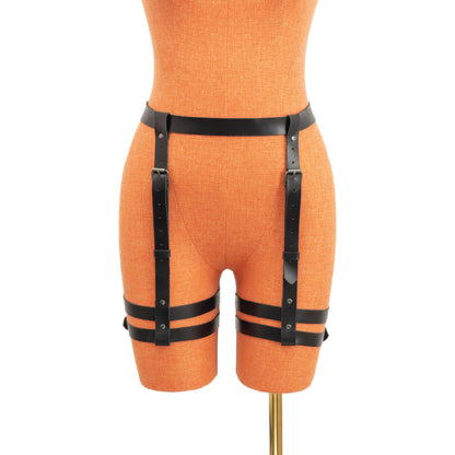 Black leather garter belt made from genuine leather with dark nickel hardware, shown on a mannequin from the front. The 1 inch (2.5 cm) waist strap connects to two vertical adjustable straps that lead to double parallel 3/4 inch (2 cm) thigh bands wrapping evenly around both legs.
