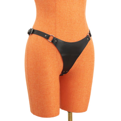 Semi-side view of black leather thong displayed on an orange mannequin. The front panel connects to side straps through metal rings, and hip straps fasten with buckles for individual adjustment on each side.
