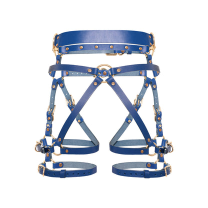 Rear close-up of a deep blue open crotch leather garter belt with a center back ring, diagonal straps, D-rings, removable leather handle, thigh straps, and gold-tone metal hardware.