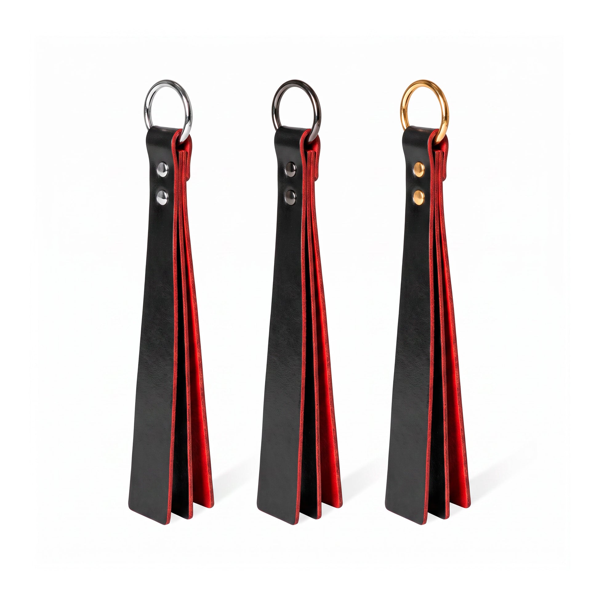Three black+red classic Short leather BDSM paddle silver, black, and gold rings, displayed side-by-side on a white background.