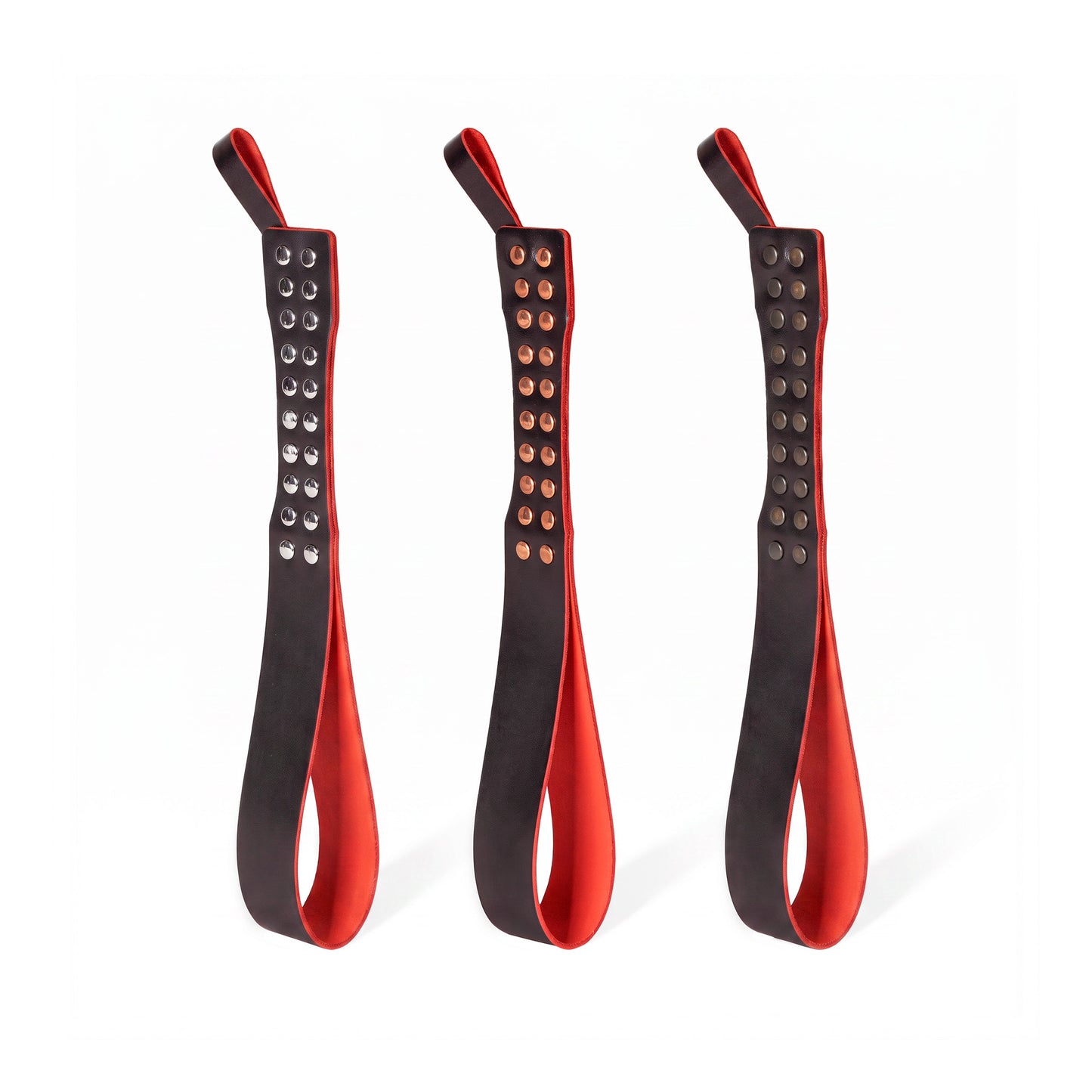Three leather Loop Core BDSM paddle  red and black coloring and silver, gold and dark nickel hardware.