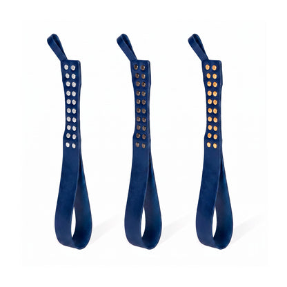 Three leather Loop Core BDSM paddle blue coloring and silver, gold and dark nickel hardware.