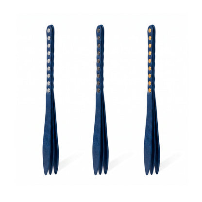 Three blue leather bdsm paddles with hardware in silver, gold and dark nickel colors.