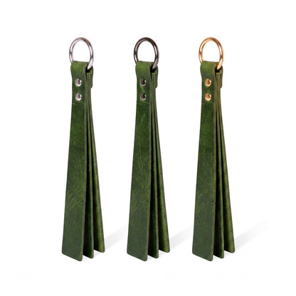 Three green classic Short leather BDSM paddle silver, black, and gold rings, displayed side-by-side on a white background.