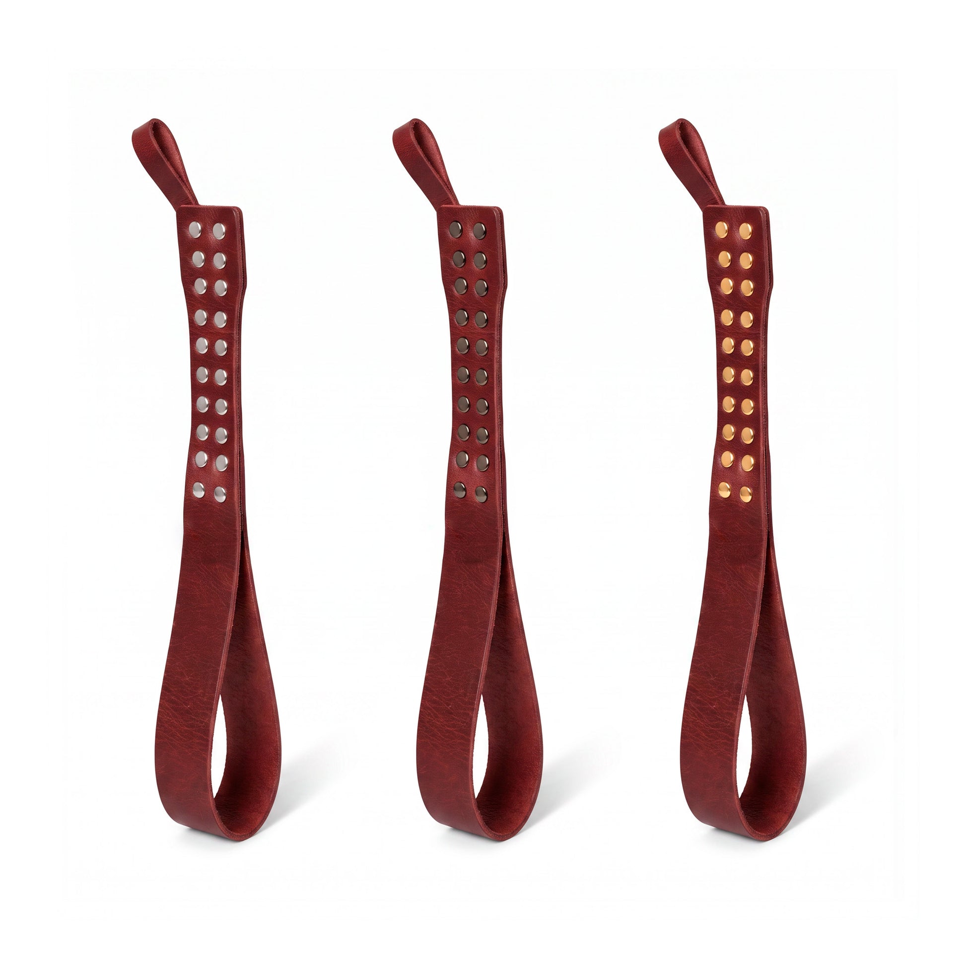 Three leather Loop Core BDSM paddle  marsala coloring and silver, gold and dark nickel hardware.