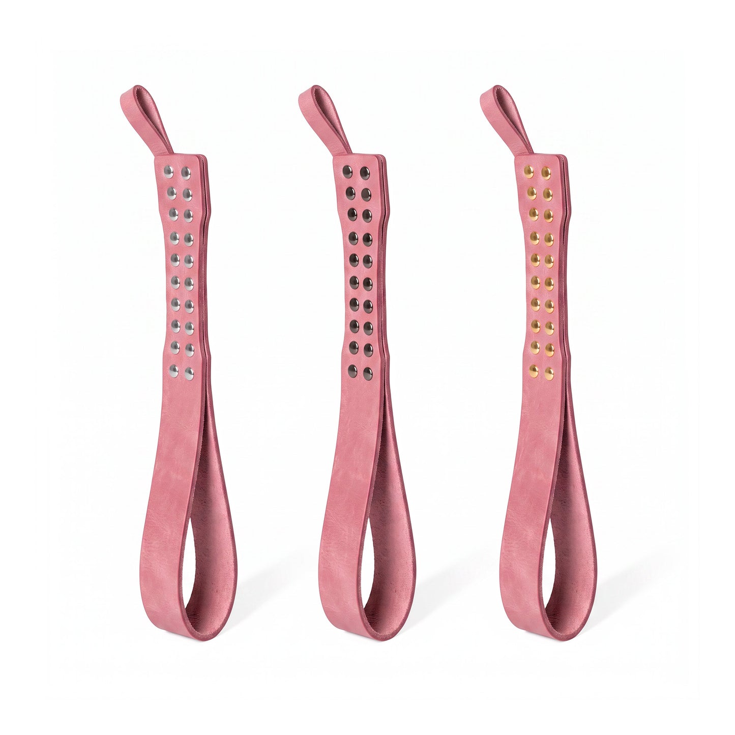 Three leather Loop Core BDSM paddle  pink coloring and silver, gold and dark nickel hardware.
